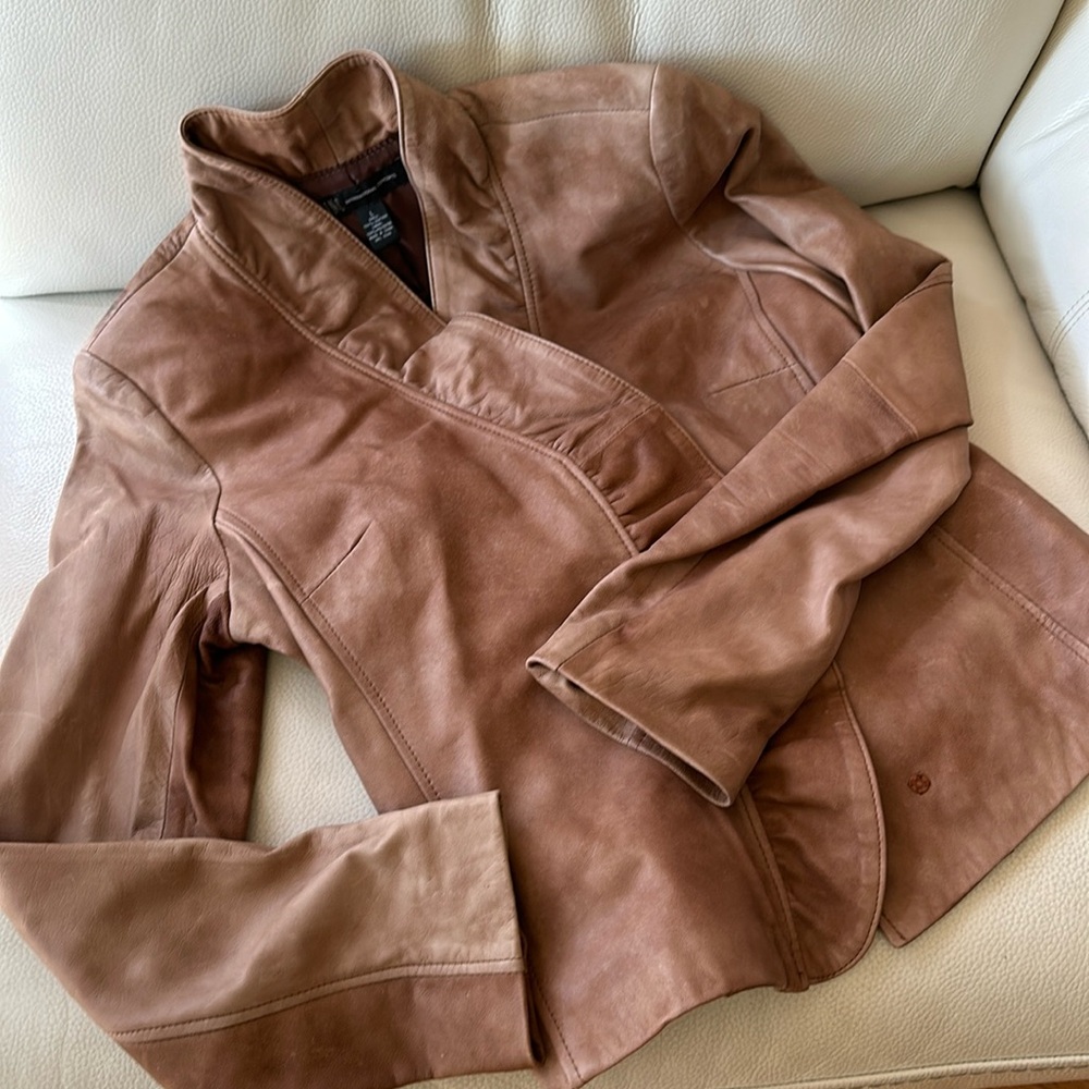 Leather ruffled jacket with snap closures